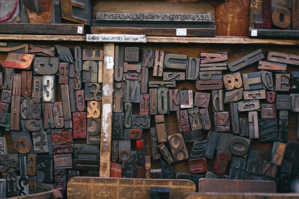 Wooden printing type stacked in a letterpress case